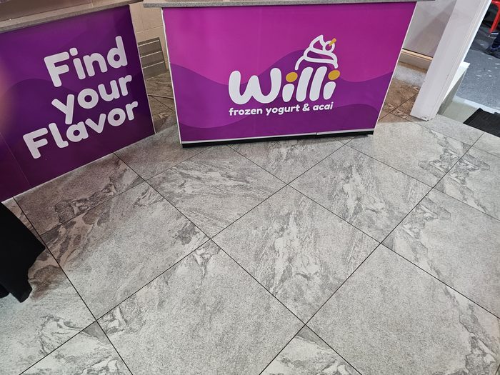Willi Counter Wrap — Printed counter wrap in brand purple with logo, Williamstown by Top1 Signs, Melbourne