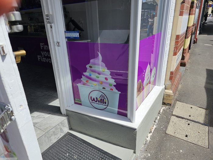 Willi Side Panel — Side panel graphics carrying the logo onto the shopfront return by Top1 Signs, Melbourne