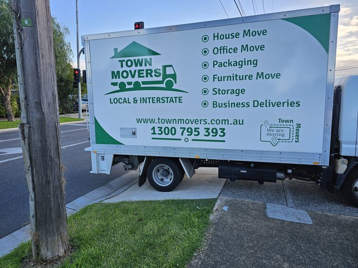 Town Movers Truck — Full side signage on a removals truck with service list and phone number by Top1 Signs, Melbourne
